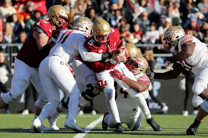 Boston College quarterback Phil Jurkovec (5) is sacked by Florida State defensive end Jermaine Johnson II (11) during the first half of an NCAA college football game, Saturday, Nov. 20, 2021, in Boston. (AP Photo/Mary Schwalm)
